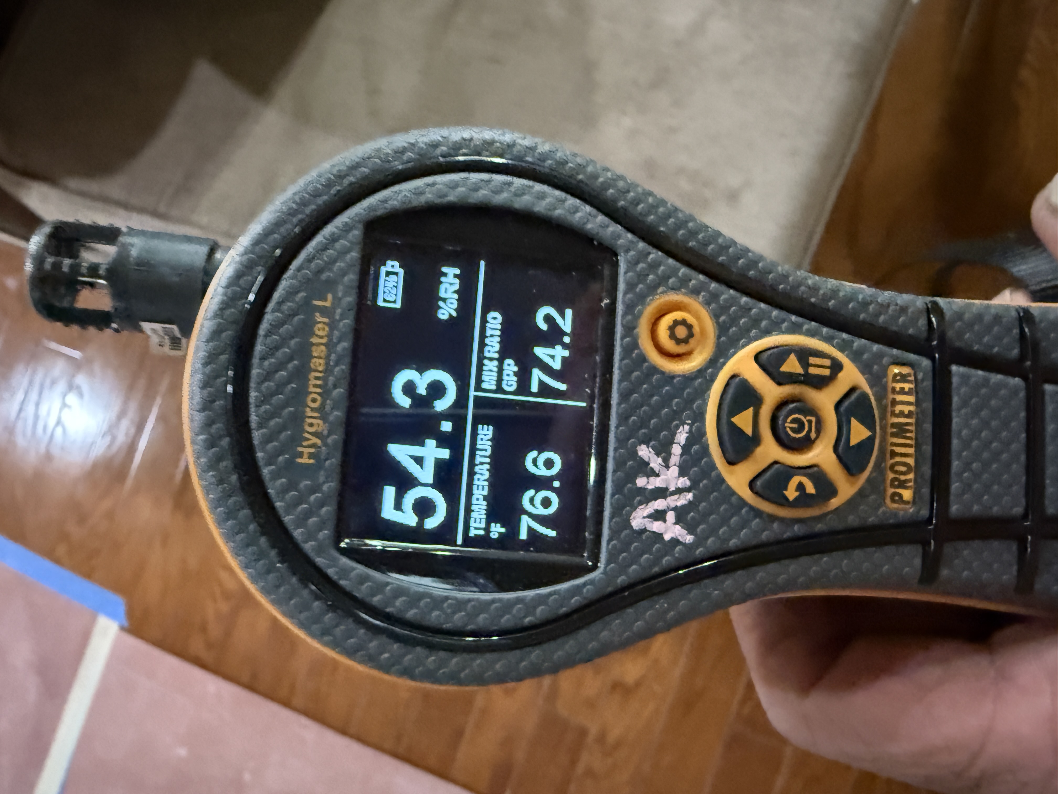 Moisture meter checking a wall for hidden dampness